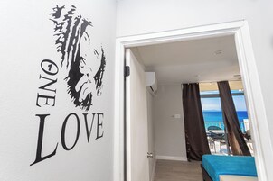 Family Apartment, 2 Bedrooms, Sea View, Tower | Living area | 50-inch Smart TV with digital channels, Netflix, streaming services