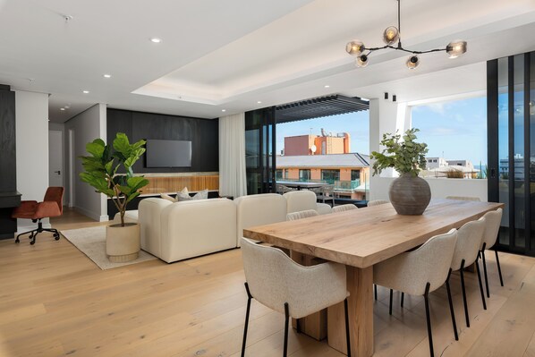 Grand Apartment | Living area | 50-inch flat-screen TV with satellite channels, Netflix - The Avant 402 (Cape Town)