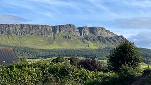 A mountainous landscape with a clear sky.