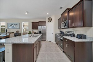 Fridge, microwave, oven, stovetop - EV_7535 - 7 Bed 5.5 Bath Villa with Screened-In Private Pool with Spillover Spa (Davenport)