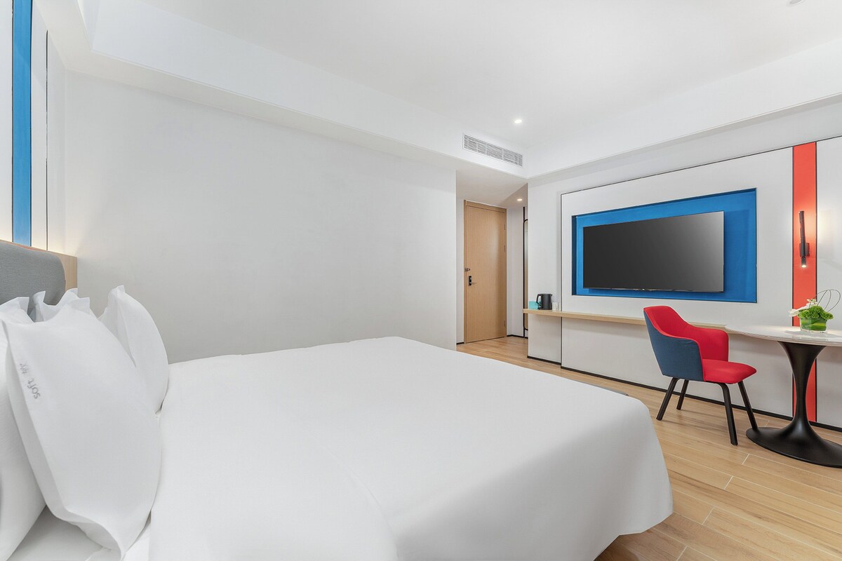 Premium bedding, down comforters, laptop workspace, blackout drapes