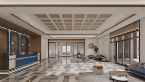 A spacious lobby with a reception desk, seating area, and large windows. - Holiday Inn Express Wenchang by IHG (Wenchang)