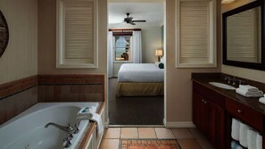 A hotel bathroom with a bathtub, a sink, and a mirror. - Hyatt Vacation Club Windward Pointe Key West. Spectacular Key West Ocean Resort (Key West)