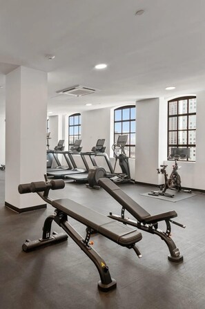 Stay fit and active in this well-equipped gym with treadmills, elliptical machines, and a bench press.