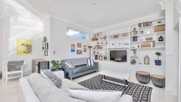 Basic House, Multiple Beds | Living area | TV