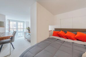 Basic Apartment, Multiple Beds | Living area | TV