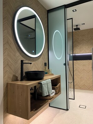 Shower, hair dryer, towels, toilet paper