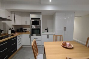 Coffee/tea maker, fridge, microwave, oven