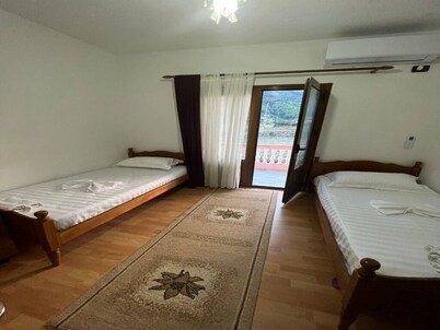 Guesthouse Space in Përmet provides accommodations with a garden.