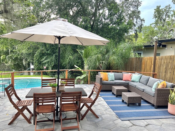 Relax on the patio with a comfortable sofa and enjoy the serene surroundings.