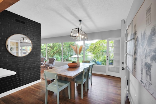 Mid-Century Boho Chic home with Pool, Game Room & Outdoor Playhouse.