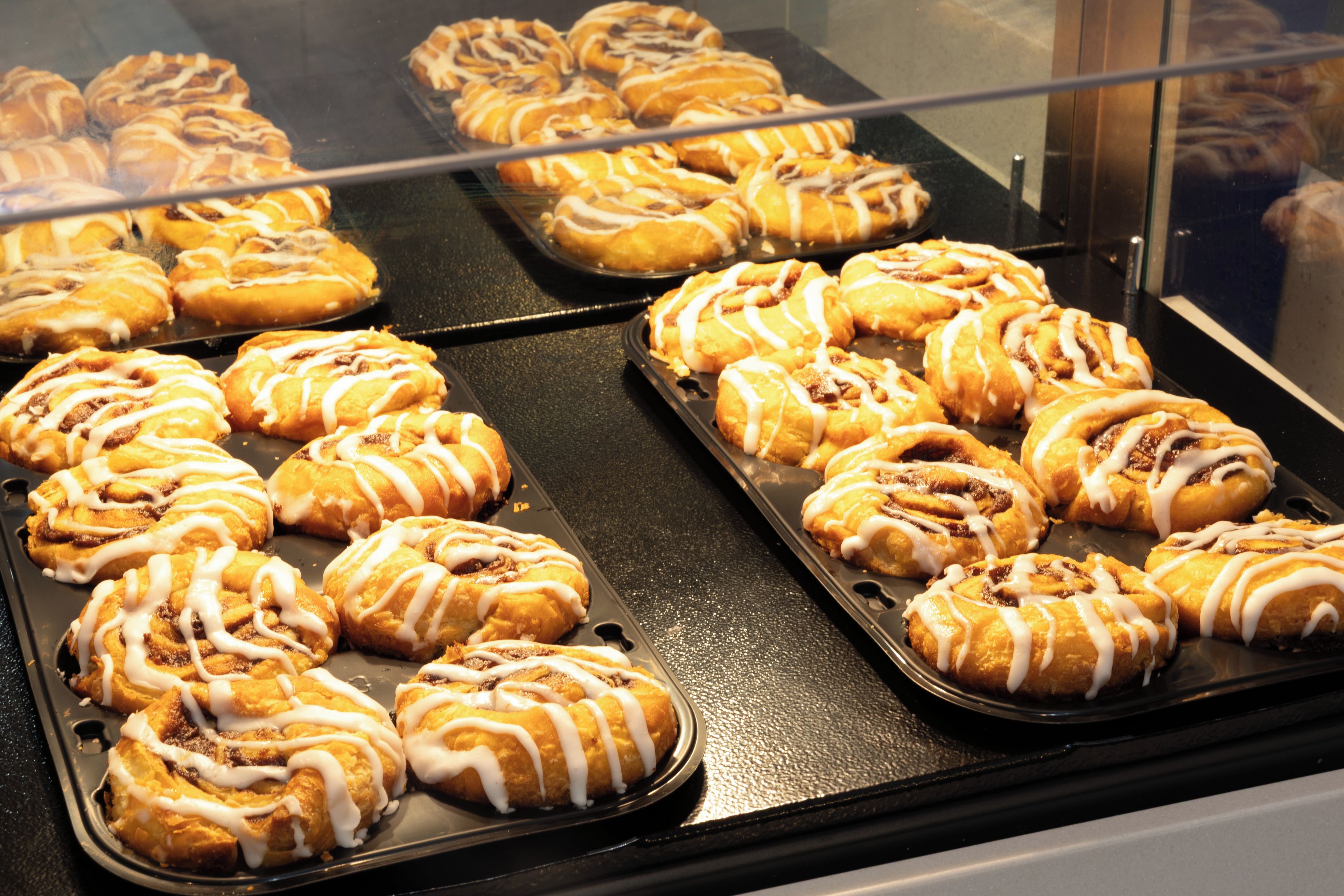 A display case containing pastries.