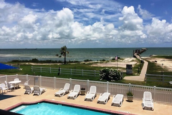 Large pool w/view! Sidewalk to our lighted fishing pier. View from our balcony