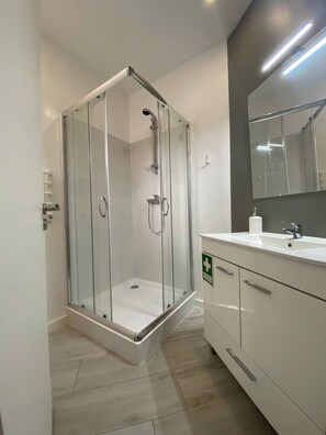 Shower, hair dryer, towels, soap