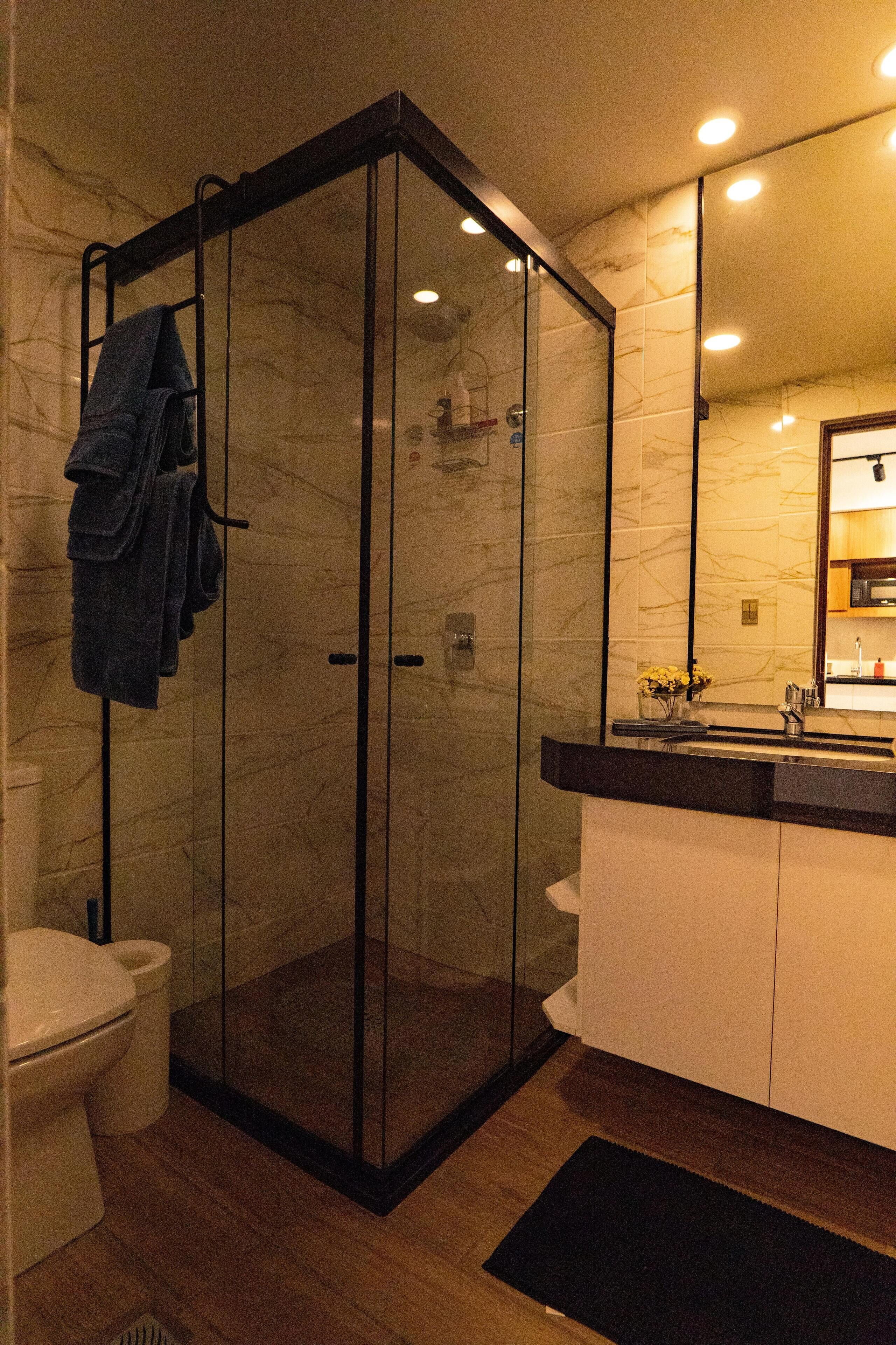 Shower, hair dryer, towels, soap