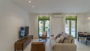 Family Villa | Living room | 55-inch Smart TV with digital channels