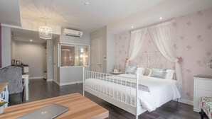 A bedroom with a bed, a desk, a chair, and a bedside table. - The star of sathon Luxury king room 502 (Krung Thep Maha Nakhon)