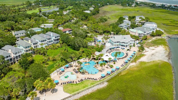 A resort with multiple buildings, a large pool area, and a beach. - Renovated Center Island Home & Garage Apt 4bd/3ba (Fripp Island)