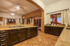 Enjoy cooking in this well-equipped kitchen with a gas stove and ample counter space.