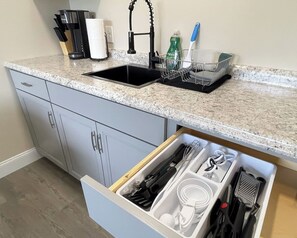 Fridge, microwave, stovetop, coffee/tea maker
