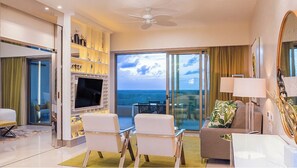 Enjoy ocean views from the large balcony, relax in the seating area with a flat-screen TV and comfortable seating for two.