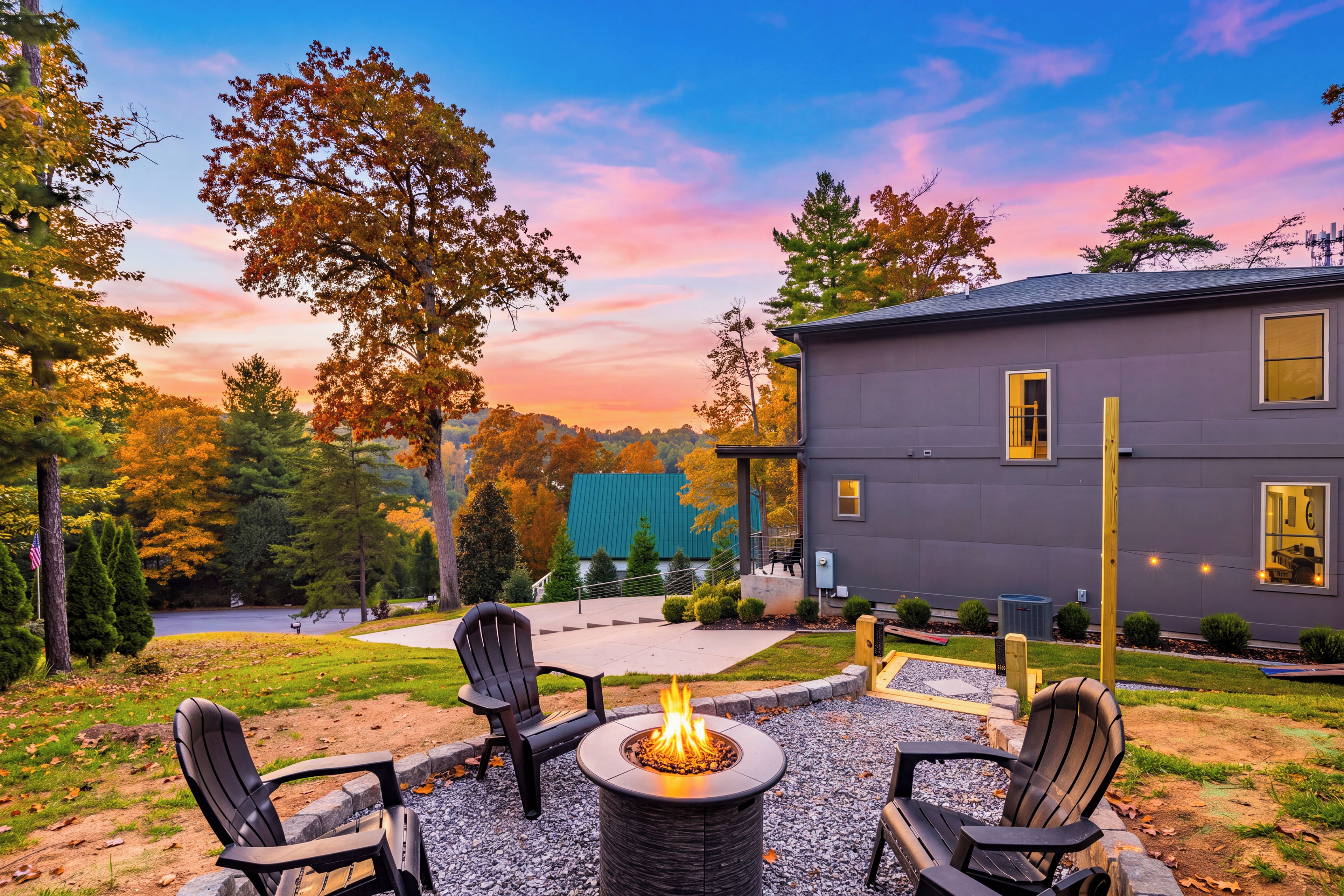 A patio area with a fire pit and outdoor seating.