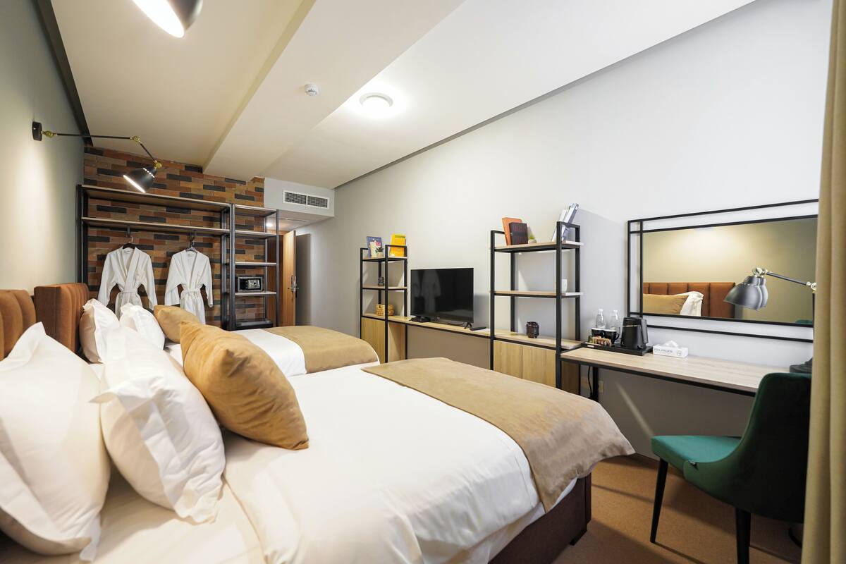 Habitación con 2 camas individuales | Ropa de cama de alta calidad y minibar 