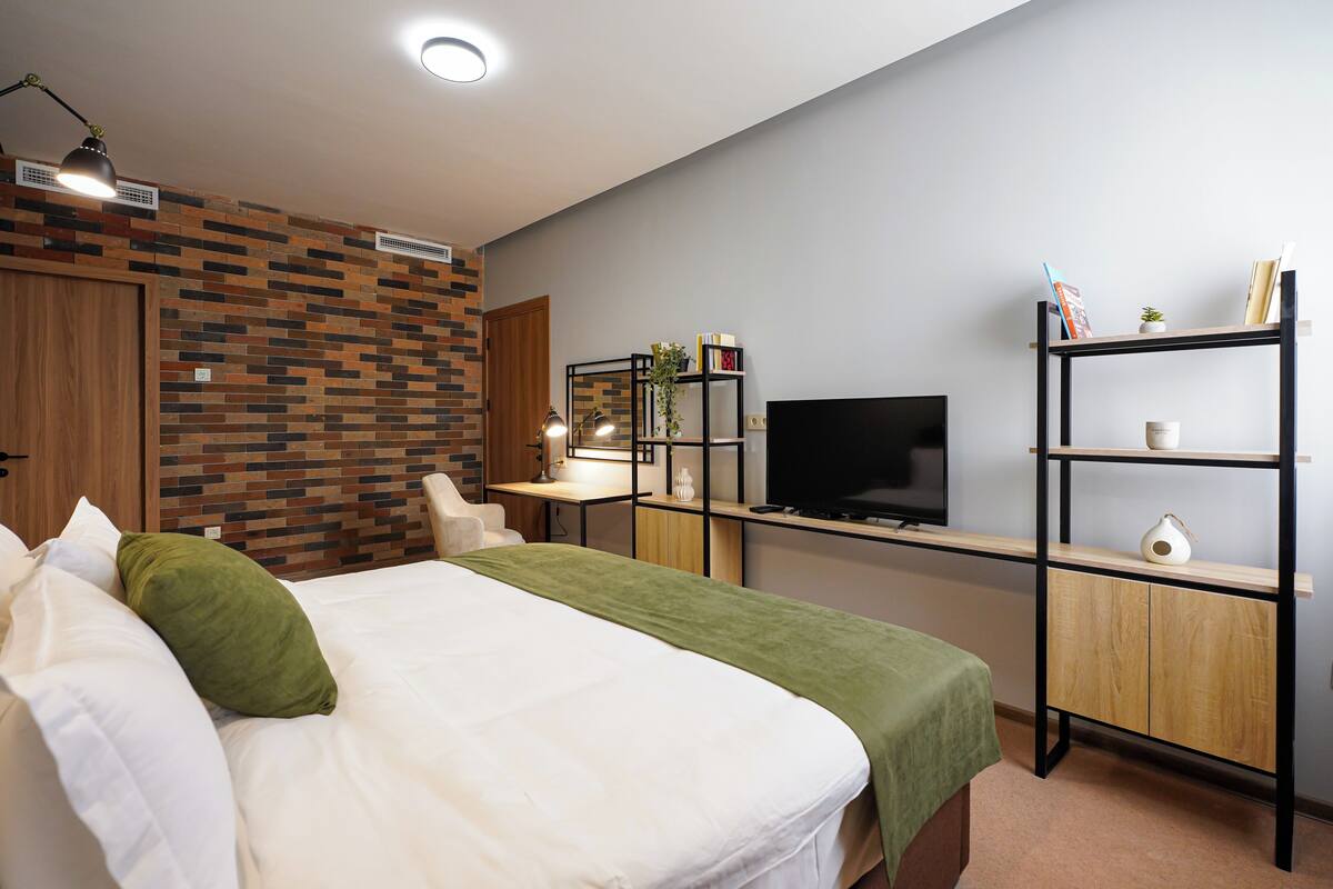 Suite de lujo | Ropa de cama de alta calidad y minibar 