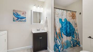 Bathtub, hair dryer, towels