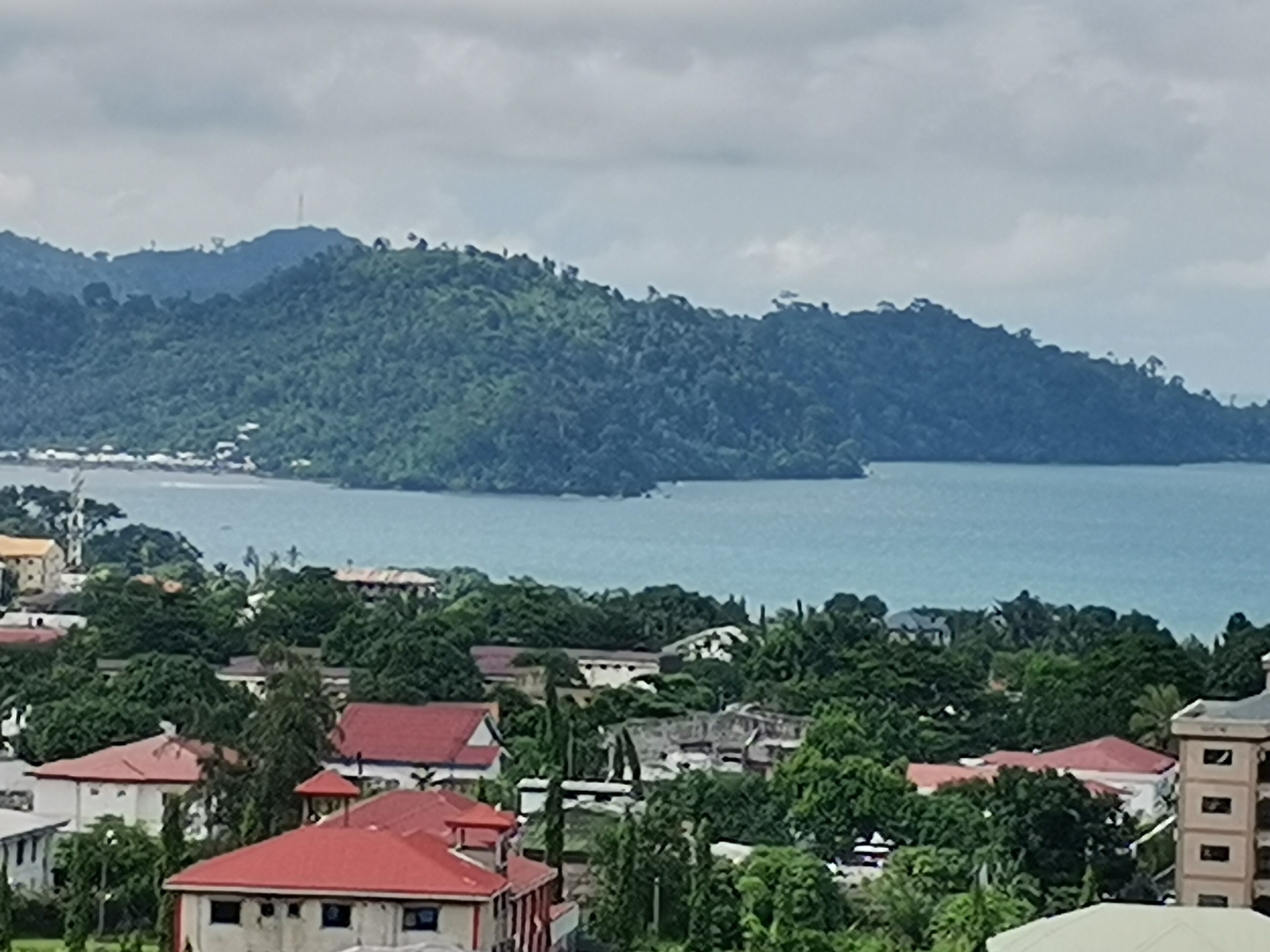 A coastal town with buildings and a view of the sea.