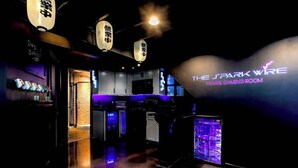 A private gaming room with neon signage, arcade machines, and a neon-lit display. - Calling All Gamers_Sleeps 10_Near MCI_Fun for All (Platte City)