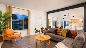 A modern living room with a sofa, armchair, and round table. - 25% Off Sep 17-20 Perfect 4 Families Pool, Jacuzzi (Palm Springs)