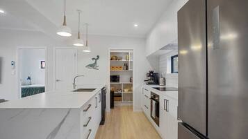 Coffee/tea maker, fridge, microwave, oven