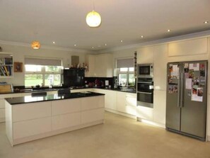 House, Multiple Beds | Private kitchen