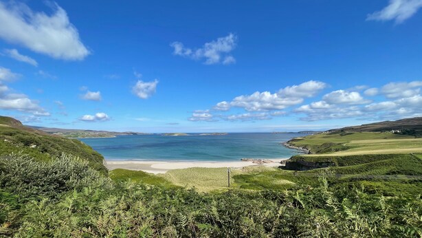 A coastal landscape with a beach, grassy hills, and a clear blue sky. - The Old Schoolhouse - Character Stay on NC500 (Tongue)