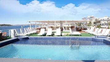 Outdoor pool, pool umbrellas, sun loungers