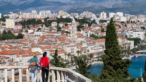 A coastal cityscape with a prominent church, a waterfront promenade, and a view of the sea. - Luxury Apartment Luft Split Near Old Town (Split)