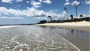 A beach with clear skies and calm waters.
