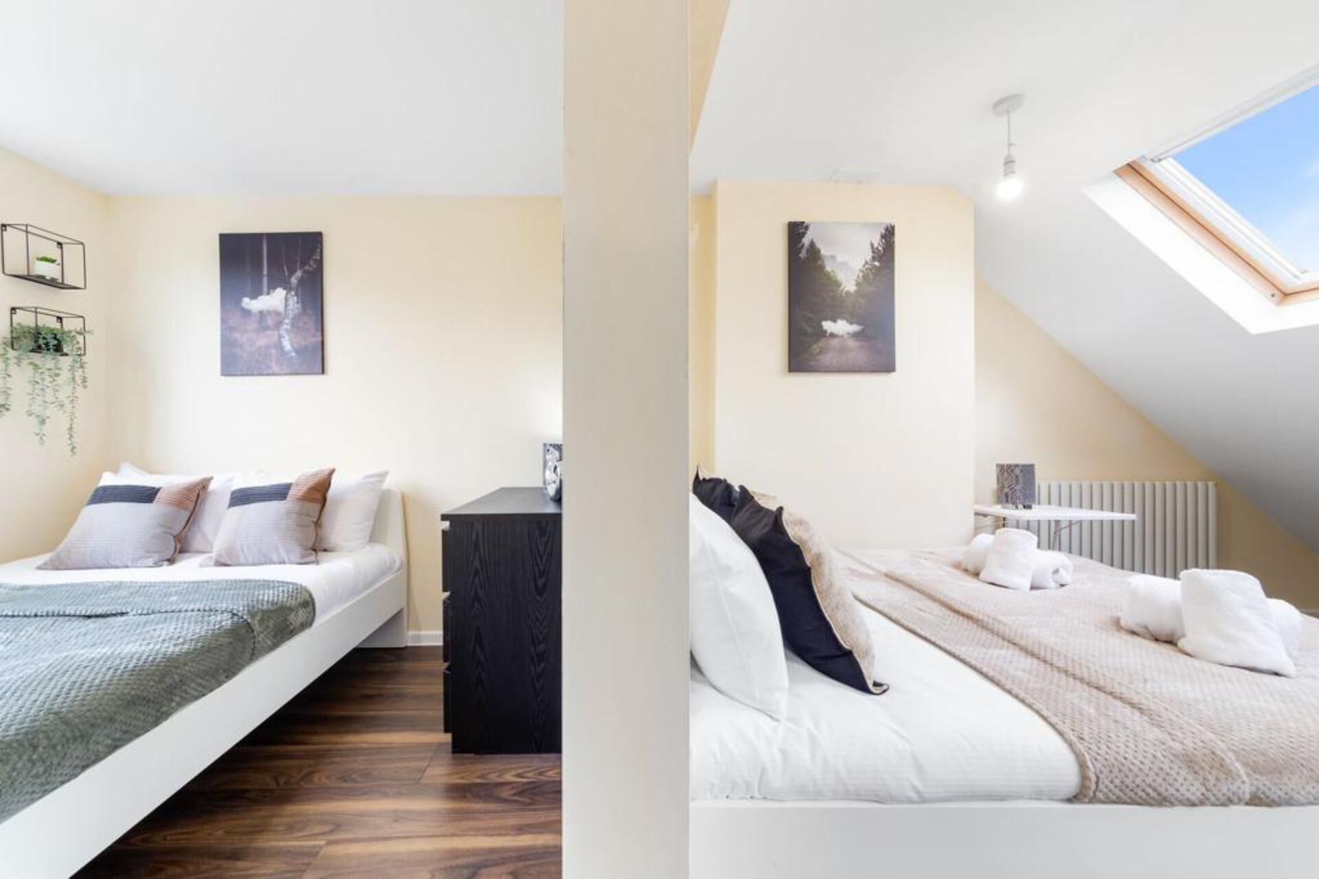 A modern bedroom with a loft bed, a small desk, and a skylight.