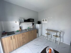 Fridge, microwave, stovetop, coffee/tea maker