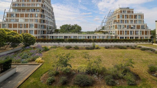 A modern apartment building with a flat roof and multiple balconies. - Stylish comfortable apartment in central Kingston - Pass the Keys (Kingston-upon-Thames)
