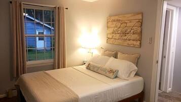 1 bedroom, desk, iron/ironing board, travel crib