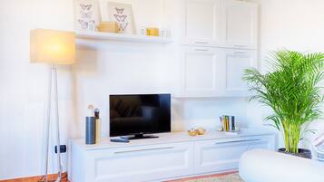 Standard Apartment | Living area | 32-inch LCD TV with cable channels