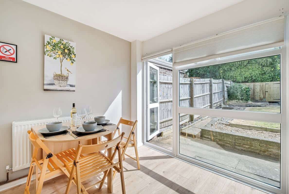 A charming dining space featuring a table with 3 chairs, perfect for intimate meals or a quick snack