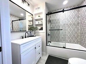 Shower, hair dryer, towels, soap