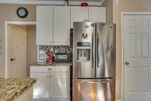 A kitchen with a stainless steel refrigerator, a microwave, and a coffee maker. - 4 Mi to Chattahoochee River: Family Home w/ Yard! (Roswell)