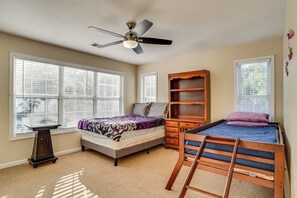 A bedroom with a bed, a desk, a dresser, and a ceiling fan. - 4 Mi to Chattahoochee River: Family Home w/ Yard! (Roswell)