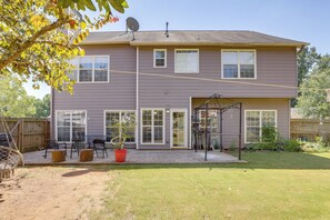 A two-story house with a patio, a swing set, and a satellite dish. - 4 Mi to Chattahoochee River: Family Home w/ Yard! (Roswell)