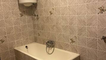 Bathtub, hair dryer, towels