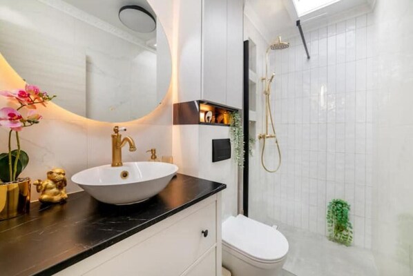 Shower, hair dryer, towels, soap